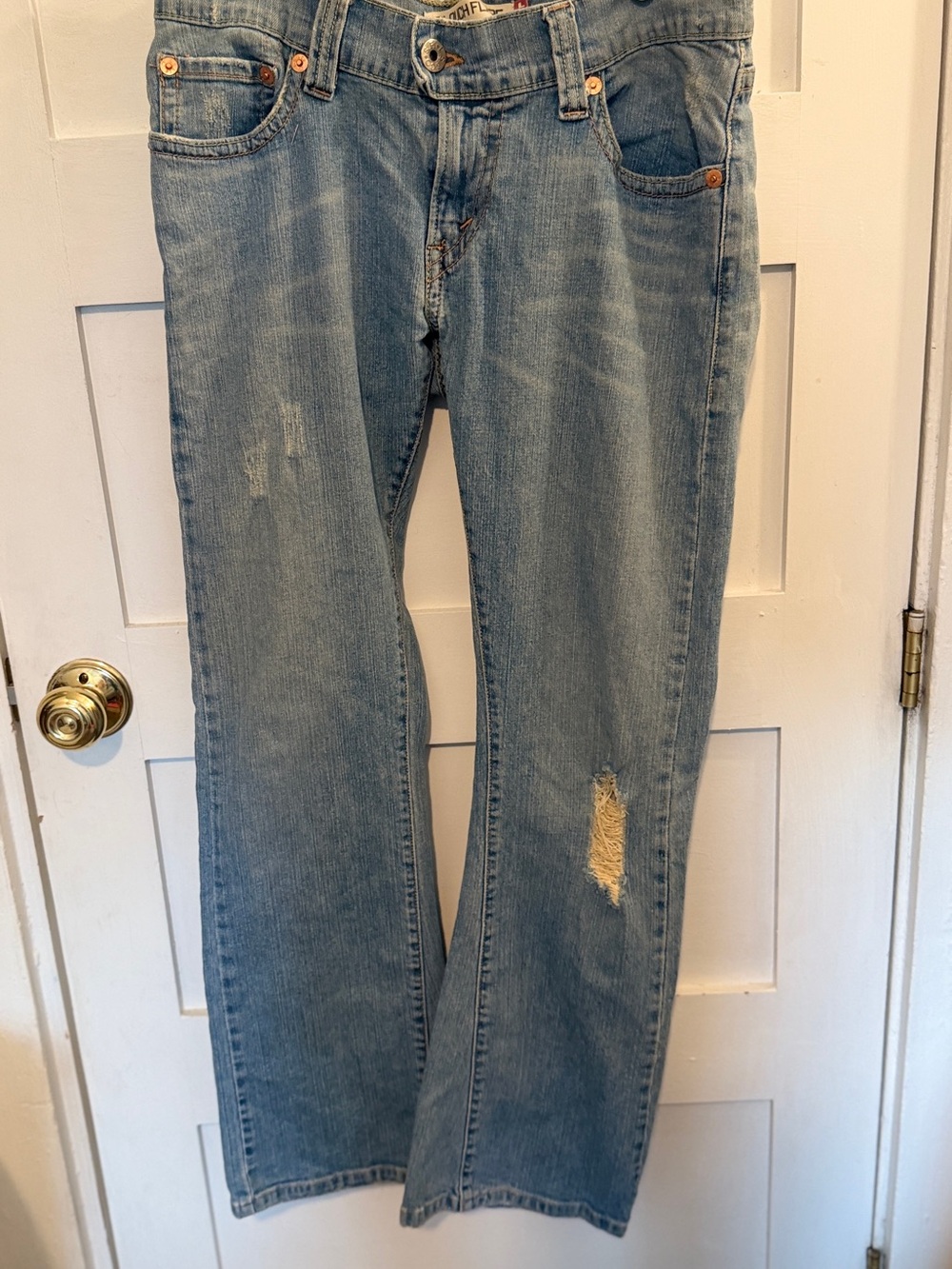 Levi's Light Blue Flare Jeans with Distressed Knee